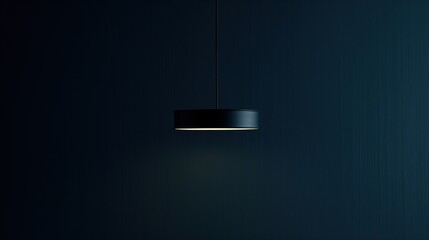 One lamp hanging from the ceiling with a dark blue wall. Copy Space