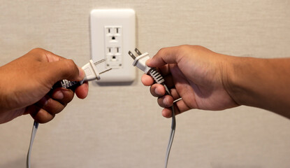 Hand insert a plug into socket.