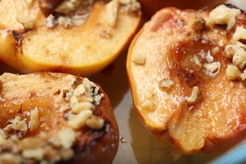 Delicious baked quinces with nuts and honey, closeup