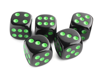 Many black game dices isolated on white
