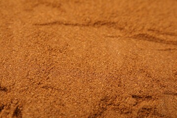 Aromatic spice. Ground red pepper as background, closeup