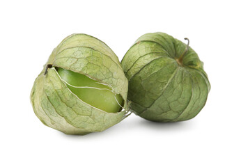 Fresh green tomatillos with husk isolated on white