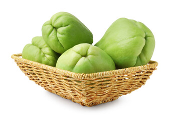 Fresh green chayote in wicker basket isolated on white