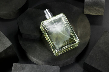 Stylish presentation of luxury men`s perfume in bottle on black background