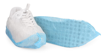 Sneakers in shoe covers isolated on white