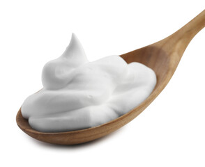 Wooden spoon with sour cream isolated on white