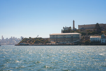 View of Alcatraz Island in San Francisco Bay, California, USA on a clear day. Iconic buildings and...