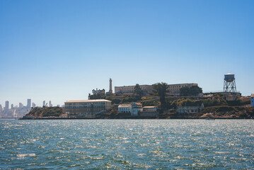 View of rugged Alcatraz Island in San Francisco Bay, California, USA. Shows main cellhouse, guard...