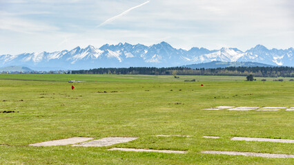 View of Tatra mountains from sport grass airfield in Nowy Targ
