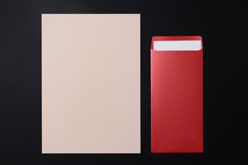 Red envelope, pink letter paper, flat lay design