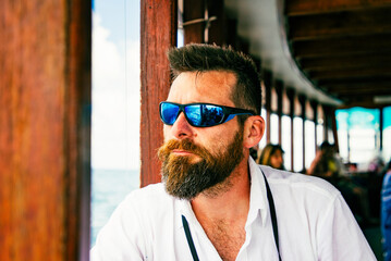 handsome caucasian man travelling on a local ferry