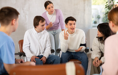 Teacher together with the students are brainstorming during a lesson at school