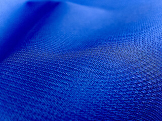 selective focus textures zigzag fabric fibers. the rough surface of the blue burlap cut