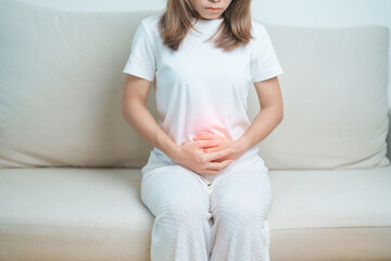 woman having abdomen ache due to Stomach pain, digestion with constipation or Diarrhea from food...