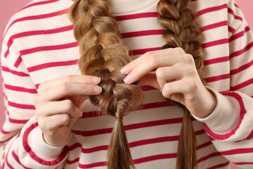 Young woman with braided hair, closeup view