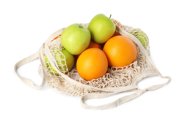 String bag with fresh apples and oranges isolated on white