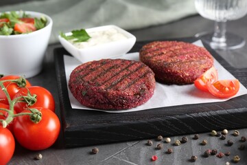 Tasty fried vegetarian cutlets served on grey table
