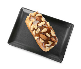 Round croissant with chocolate paste and nuts isolated on white, top view. Tasty puff pastry