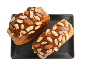 Round croissants with chocolate paste and nuts isolated on white, top view. Tasty puff pastry