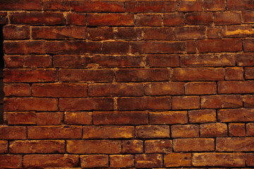 Old vintage detailed bright red yellow brick and block wall