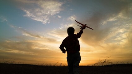 child kid girl with toy pilot runs into sunset dream flying flight, twilight imagination play,...