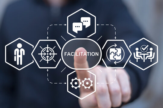 Facilitator working on virtual touch screen presses word: FACILITATION. Concept of facilitation. Business and finance facilitating.