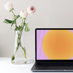 Laptop with gradient wallpaper, minimal workspace, roses in vase