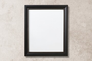 Black picture frame, beige wall, room interior design