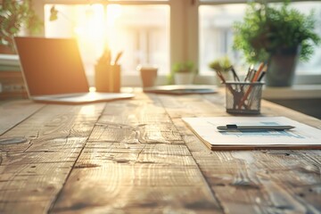 A desk with a laptop, a pen, and a cup of coffee. The desk is in a sunny room with a potted plant in the background