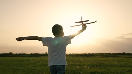 boy son child running airplane game flight dream playground green field sunset pilot, evening field...
