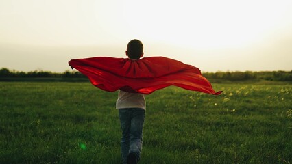 boy son child superhero game running park field sunset grass victory red cloak fancy dress, victory...