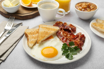 Delicious breakfast with sunny side up egg served on light table