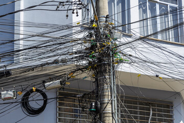 Tangled electrical wiring on a street pole in Juiz de Fora, state of Minas Gerais, Brazil