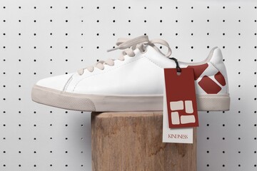 White canvas sneakers, street apparel with brand label