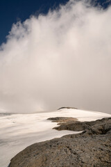 Alpine landscape. High in the Andes cordillera mountains. View of glacier Castaño Overo and Tronador hill under a cloudy sky. Beautiful white snow colors and ice texture.