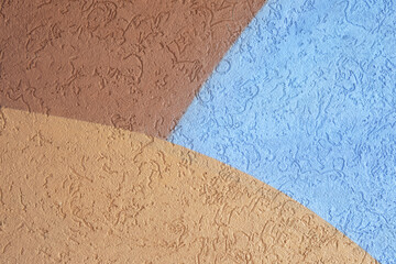 Tricolor three colors modern wall in blue, brown and beige. Lovely plastered walls backgounds...