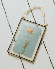Vintage frame, flower artwork on floor