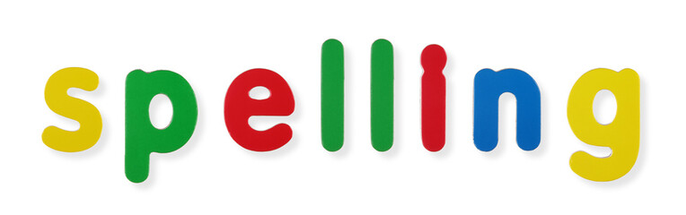 Spelling word in coloured magnetic letters