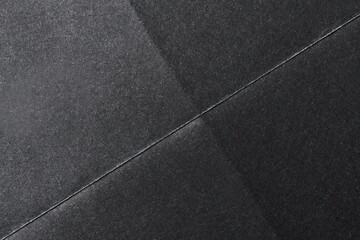 Fototapeta premium Folded black paper texture background