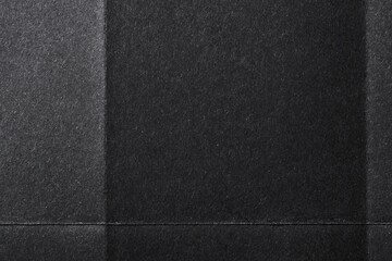 Fototapeta premium Folded black paper texture background