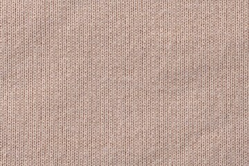 Brown background, knitted fabric texture, macro shot