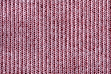 Fototapeta premium Pink knitted fabric texture background