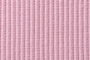 Pink background, knitted fabric texture, macro shot