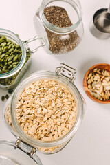 Oatmeal, chia and pumpkin seeds in a glass jars