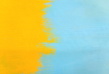 yellow blue paint brush on wood