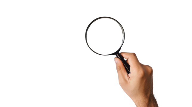 Hand holding magnifying glass
