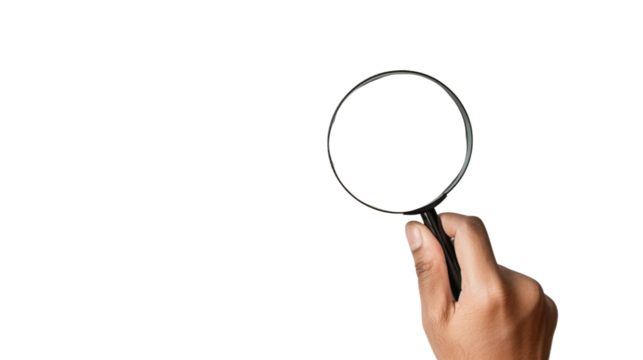 Hand holding magnifying glass