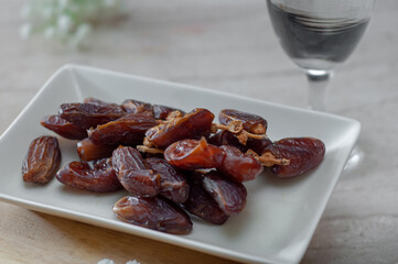 Dates and pure drinking water is consume to end Ramadan fast. Breaking Ramadan fast at Iftar.
