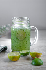 lime water and dates fruit lay on marble table.
