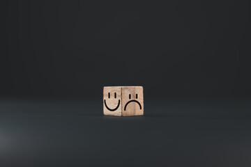 Mental health and emotional state concept, Smile face in bright side and sad face in dark side on...